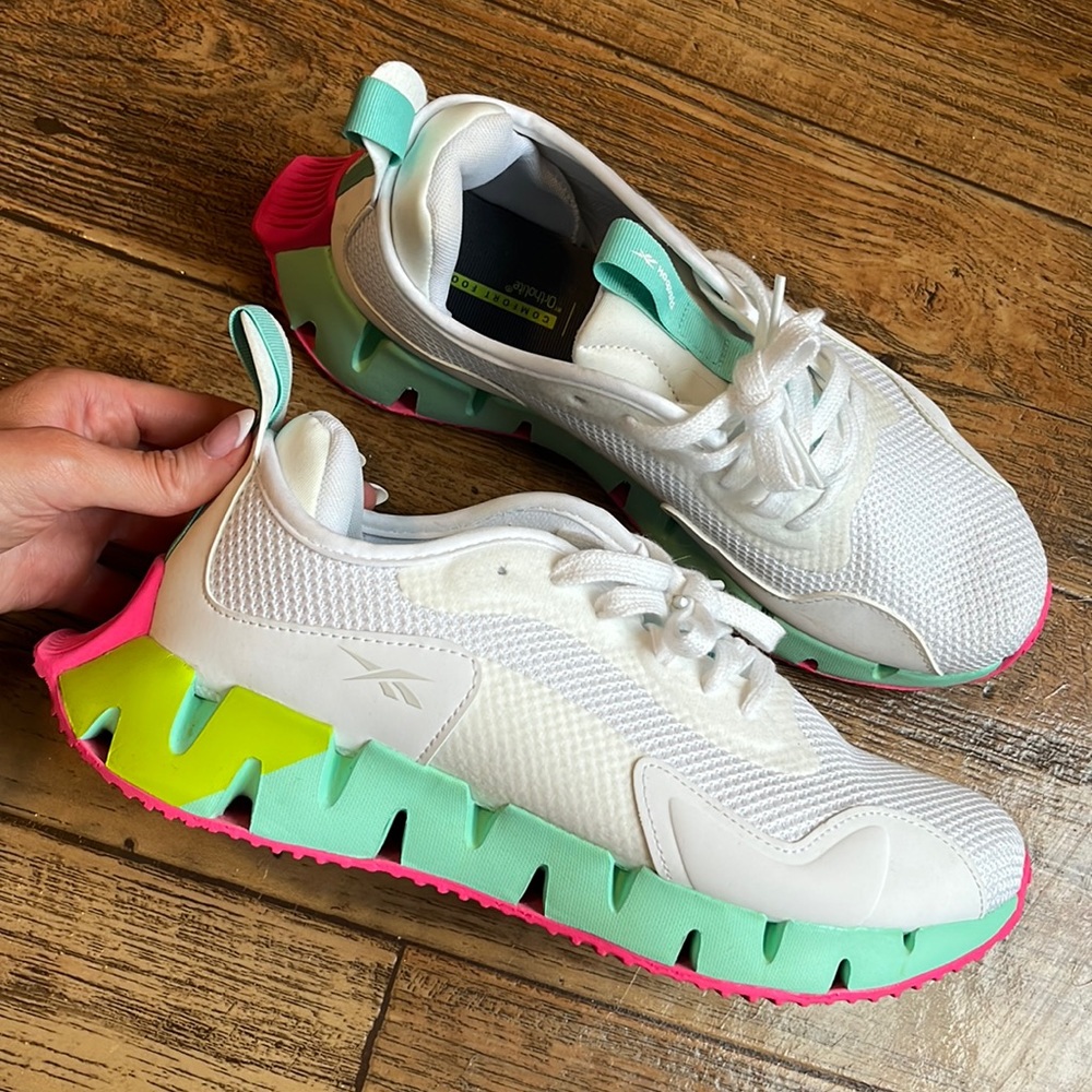 Reebok white shoes with colorful bottom. Super comfortable orthopedic foam.